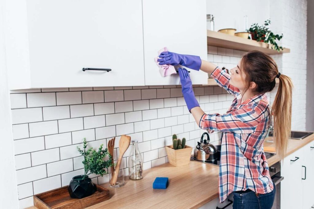 person cleaning the kitchen