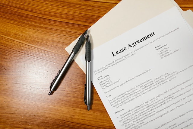 White paper that reads "Lease Agreement" in black letters at the top