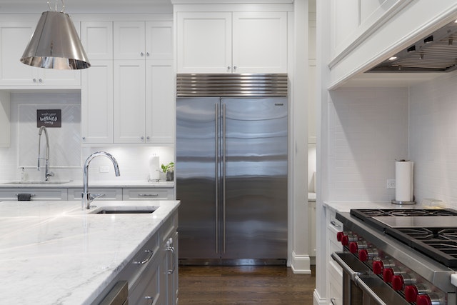 picture-of-kitchen-with-stainless-steel-appliances-and-white-counters