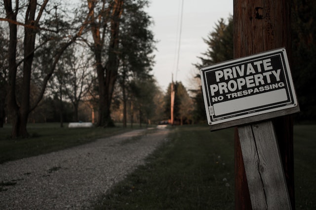 a private property and no trespassing sign outside a home