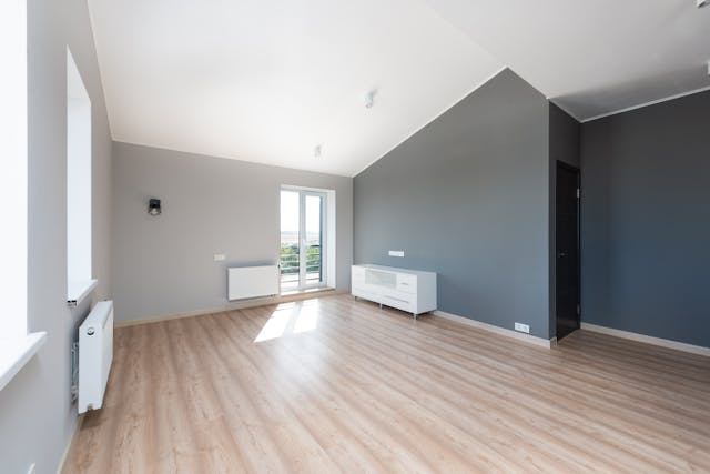 an unfurnished apartment with wood flooring